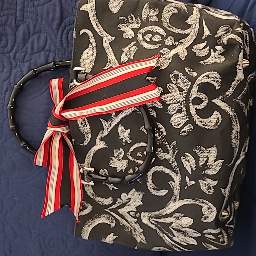 Boutique bag, black and white print with black and white houndstooth interior.